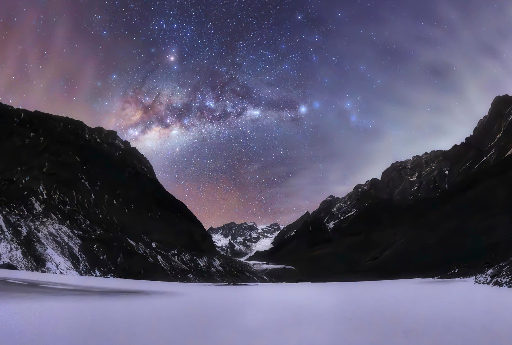The Milky Way arching over the peaks above Rakchham